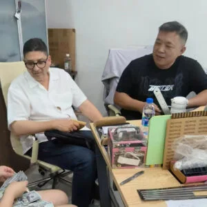 Buyer visit and quality review at the metal luggage workshop