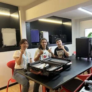 Overseas customer inspecting aluminum luggage production