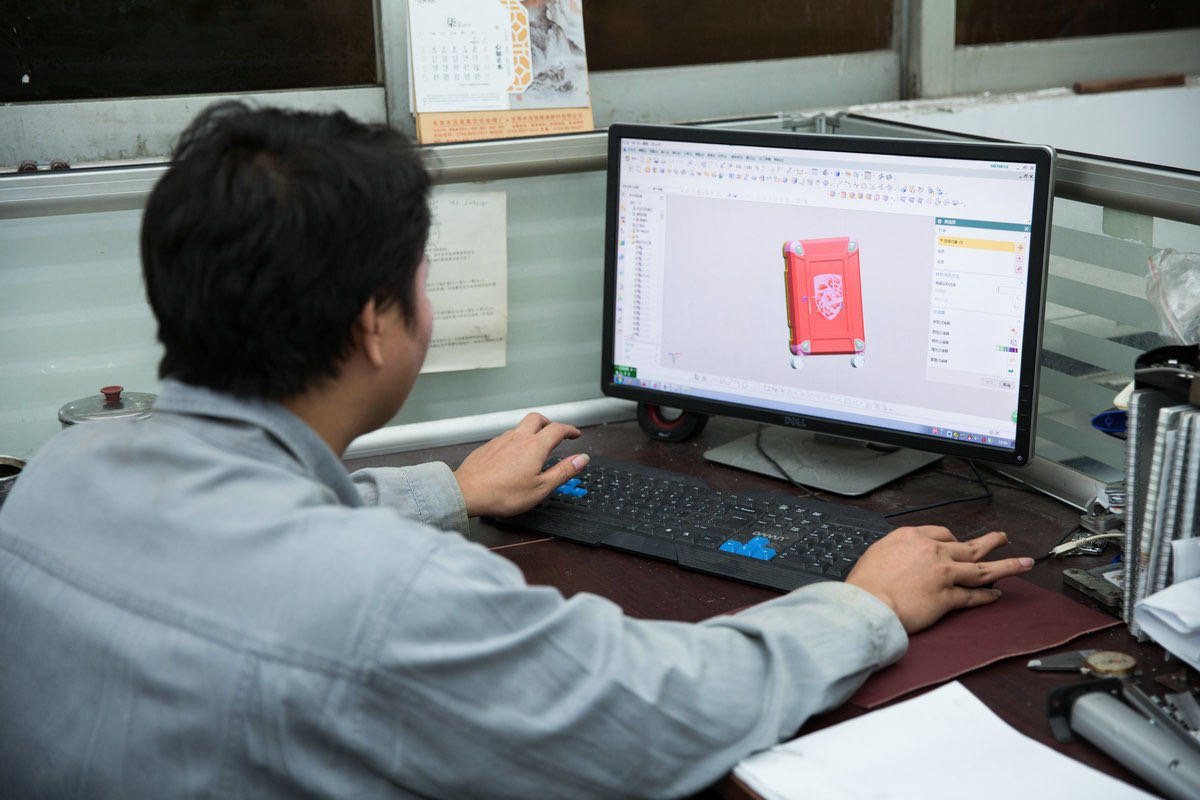 Designer viewing a luggage CAD model