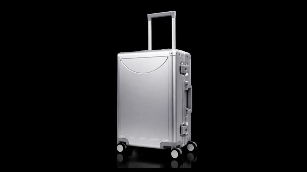 YCT-009 silver aluminum-magnesium suitcase on black.