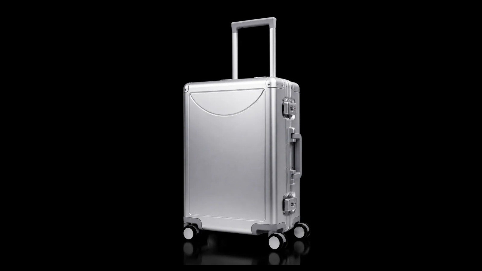 YCT-009 silver aluminum-magnesium suitcase with a plain shell face, shown in full against black.