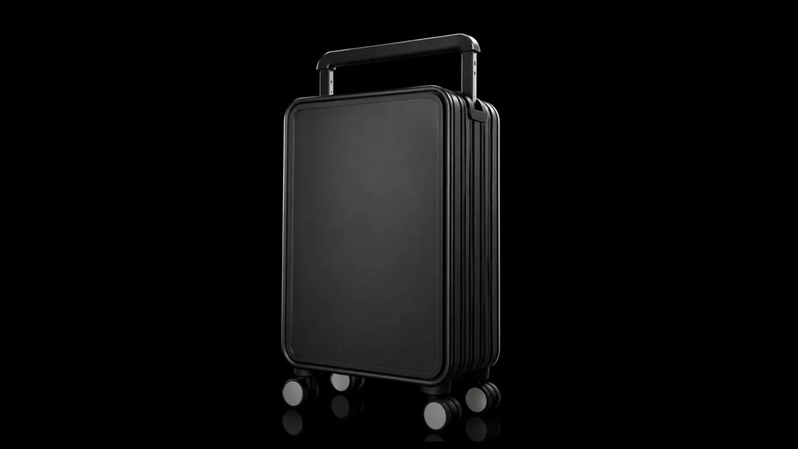 Wide-handle aluminum suitcase against a black background