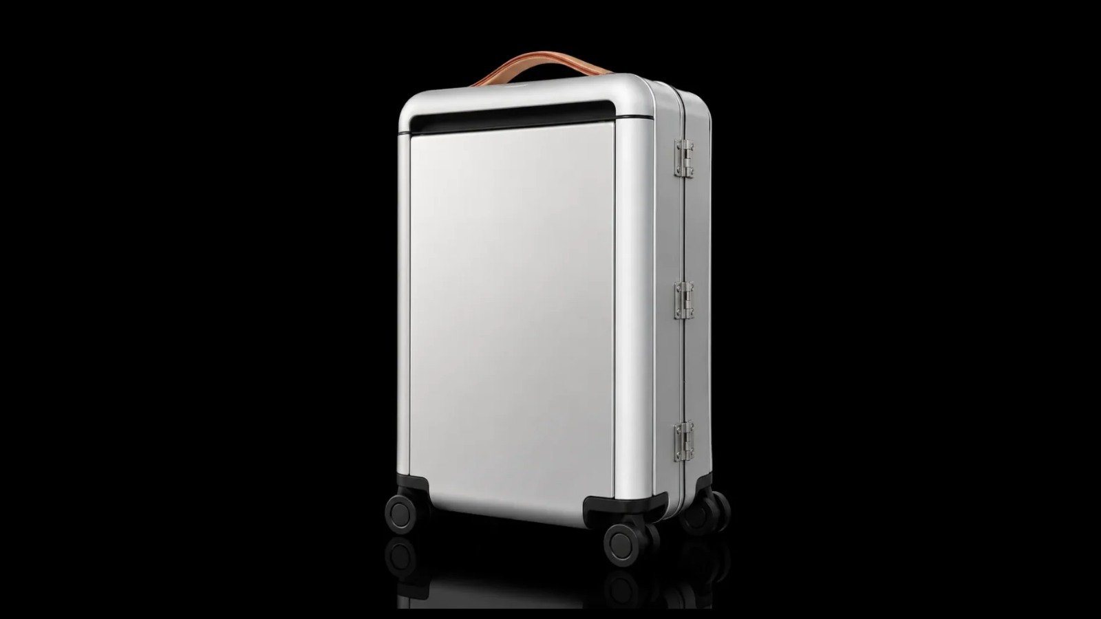 TS-010 rounded-frame aluminum suitcase on a black background