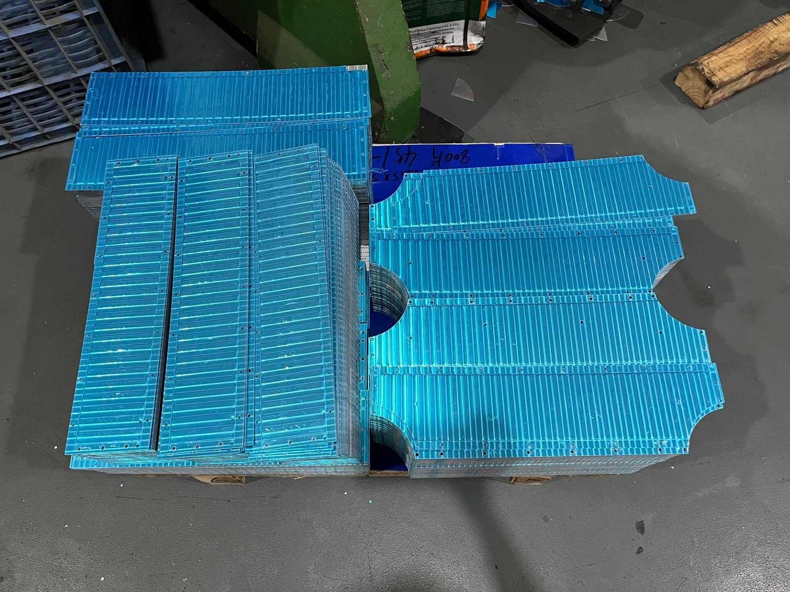 Prepared YCT-026 panels showing ribs, edge cutouts and rows of holes
